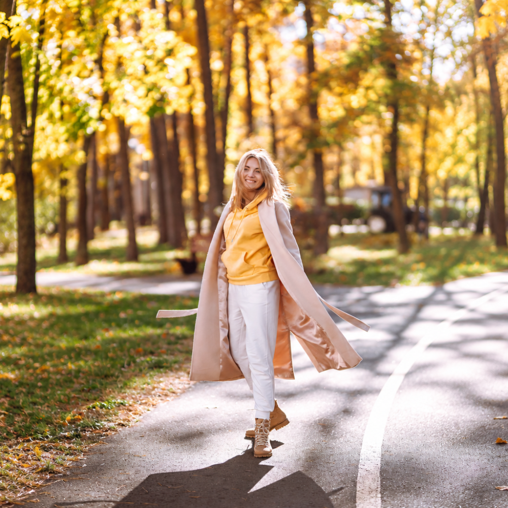 fear of man - woman on a tree lined path